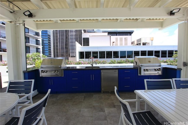 225 Queen St Unit 8C, Honolulu, HI 96813 - view of patio with a grill, an outdoor kitchen, and a sink