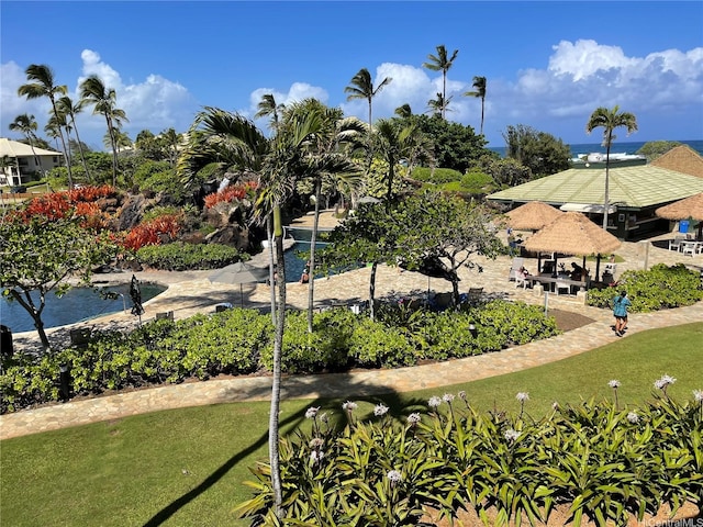 4331 Kauai Beach Dr Unit 3308, Lihue, HI 96766 - view of property's community with a yard and a small pond
