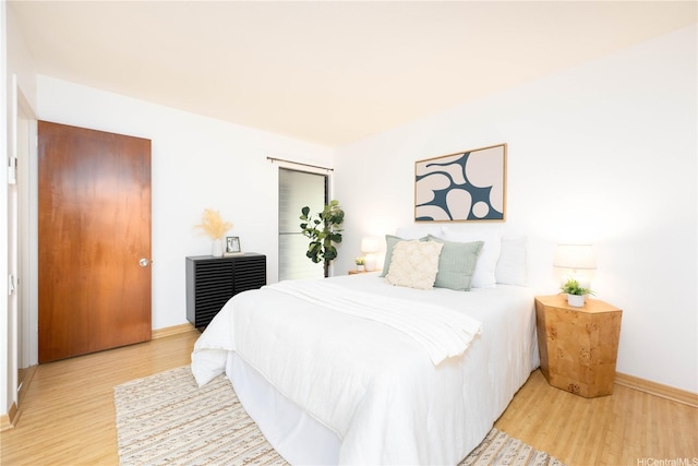 46-058 Aliikane Pl Unit 2114, Kaneohe, HI 96744 - bedroom featuring light wood-type flooring and baseboards