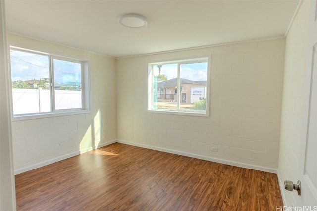 empty room with dark wood-style floors and baseboards