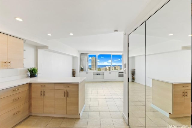2333 Kapiolani Blvd Unit 2515, Honolulu, HI 96826 - kitchen with light countertops, light brown cabinets, a peninsula, light tile patterned floors, and recessed lighting