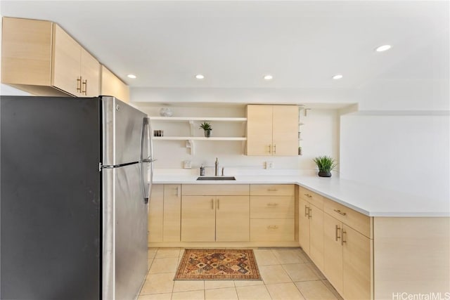 2333 Kapiolani Blvd Unit 2515, Honolulu, HI 96826 - kitchen featuring open shelves, a sink, freestanding refrigerator, a peninsula, and light brown cabinets