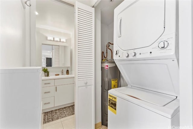 2333 Kapiolani Blvd Unit 2515, Honolulu, HI 96826 - laundry room with water heater, light tile patterned flooring, a sink, stacked washer / dryer, and laundry area