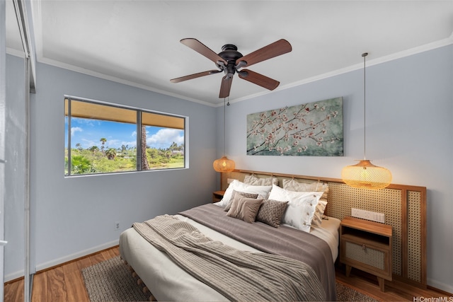 1450 S Kihei Rd Unit C204, Kihei, HI 96753 - bedroom featuring wood finished floors, ornamental molding, baseboards, and a ceiling fan