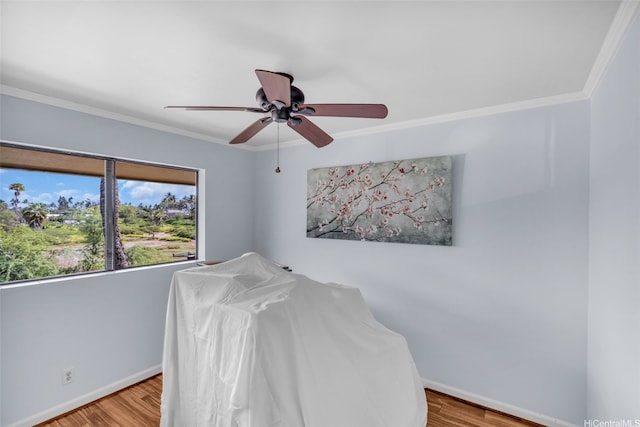 1450 S Kihei Rd Unit C204, Kihei, HI 96753 - bedroom featuring baseboards, wood finished floors, crown molding, and a ceiling fan