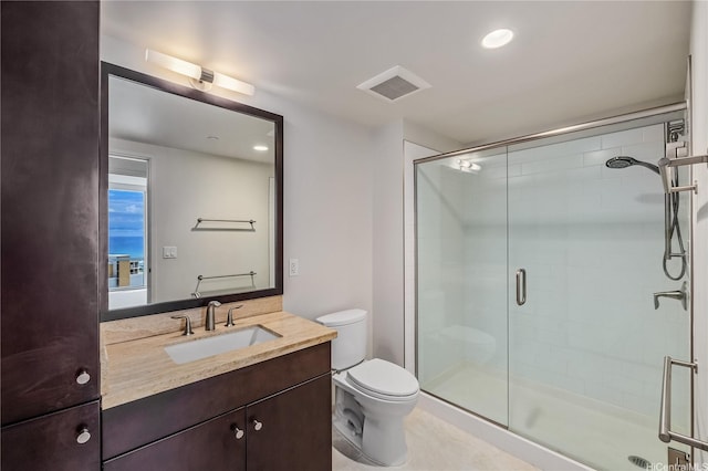 1189 Waimanu St Unit 3502, Honolulu, HI 96814 - bathroom with visible vents, a shower stall, vanity, toilet, and recessed lighting