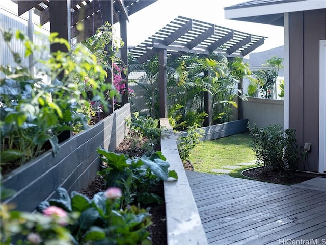 exterior space with a pergola, fence, and a lawn
