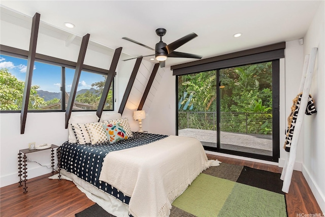 bedroom with recessed lighting, access to outside, wood finished floors, and baseboards