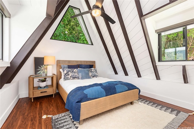 bedroom featuring wood finished floors and baseboards