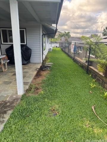 view of yard with a patio and fence