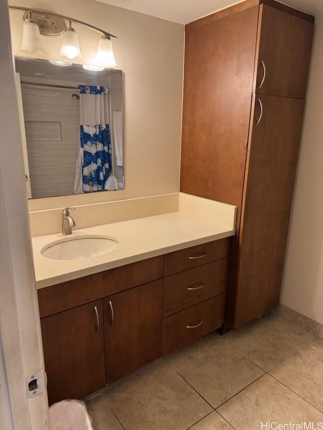 full bath featuring vanity, tile patterned flooring, and a shower with shower curtain