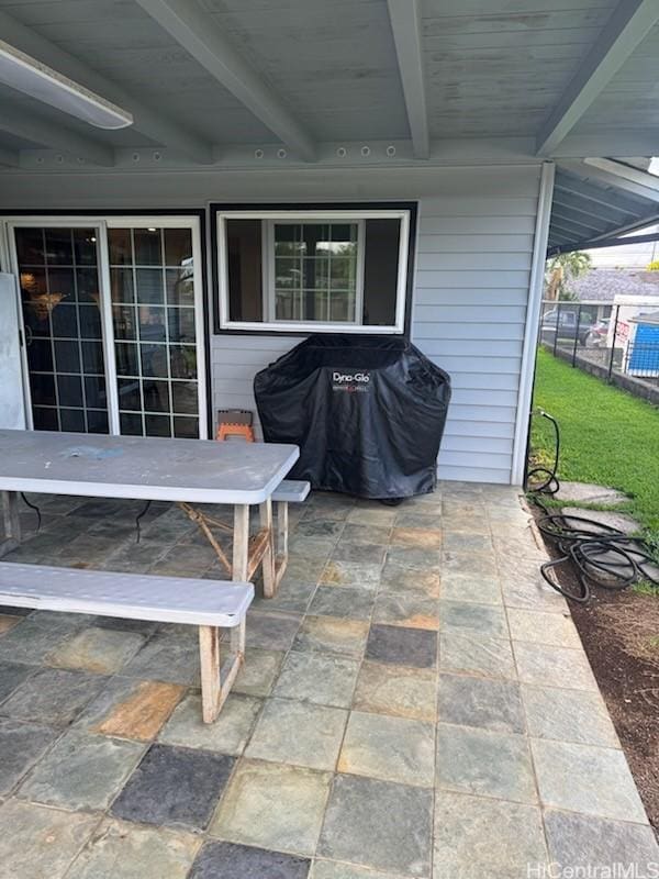 view of patio / terrace featuring grilling area and fence