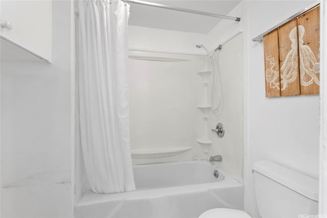 bathroom with toilet and shower / bath combo with shower curtain
