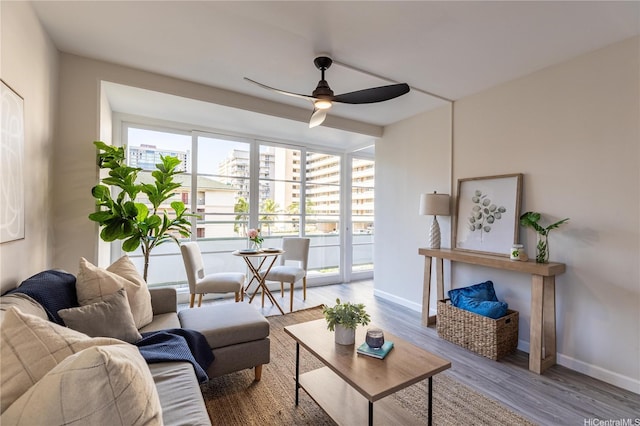 445 Kaiolu St Unit 604, Honolulu, HI 96815 - living area featuring ceiling fan, baseboards, and wood finished floors