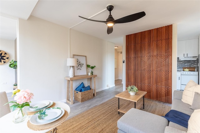 445 Kaiolu St Unit 604, Honolulu, HI 96815 - living room with wood finished floors and a ceiling fan