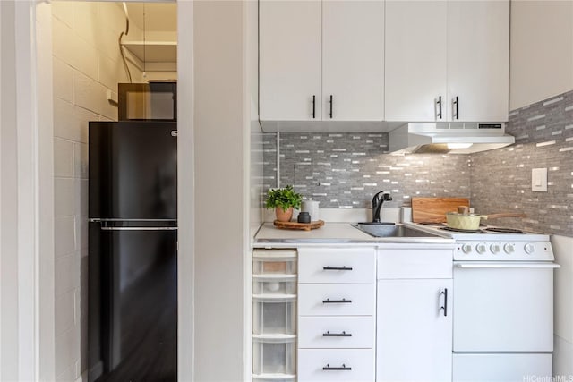 445 Kaiolu St Unit 604, Honolulu, HI 96815 - kitchen featuring freestanding refrigerator, under cabinet range hood, electric range, a sink, and white cabinets