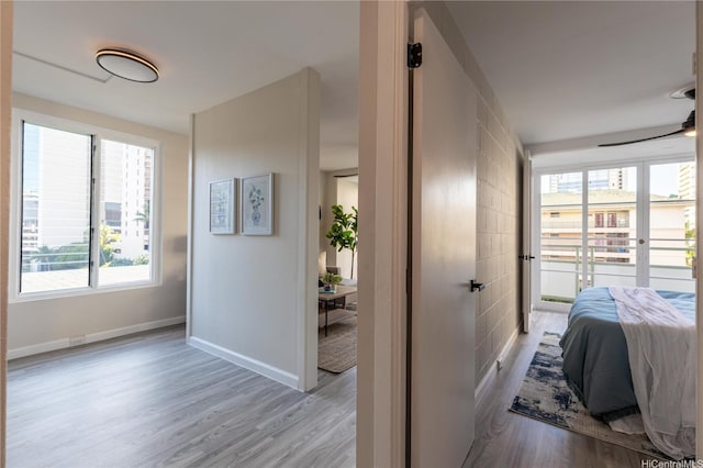 445 Kaiolu St Unit 604, Honolulu, HI 96815 - bedroom with wood finished floors and baseboards