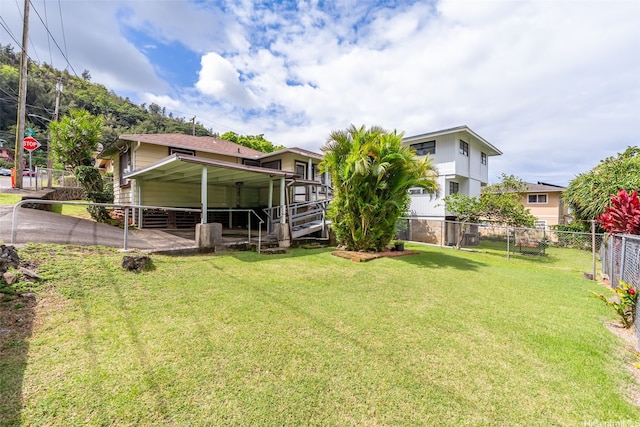 view of yard with a carport