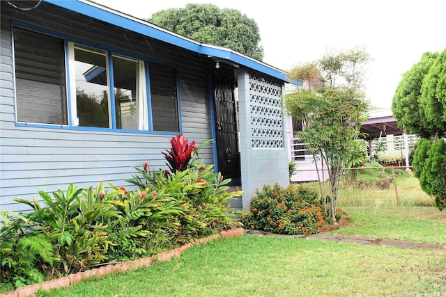 exterior space with a yard and fence