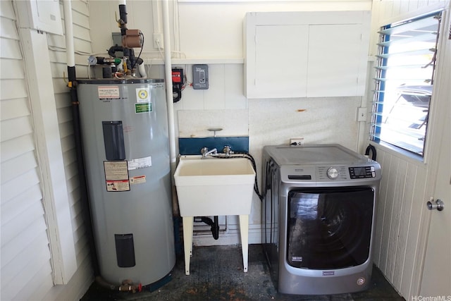 clothes washing area with laundry area, electric water heater, and washer / dryer