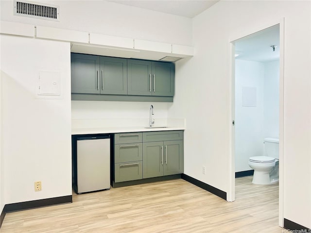 1188 Bishop St Unit 601, Honolulu, HI 96813 - indoor wet bar with fridge and light wood-style floors