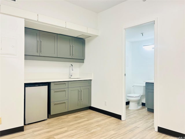 1188 Bishop St Unit 601, Honolulu, HI 96813 - indoor wet bar with dishwasher and light wood finished floors
