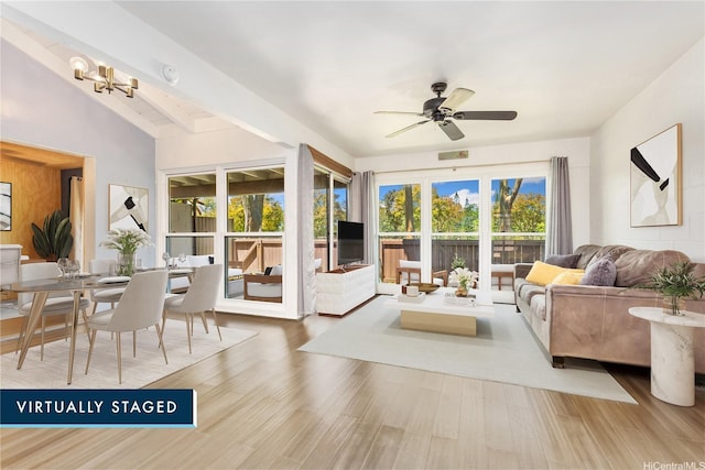 95-046 Hokuiwa St Unit 12, Mililani, HI 96789 - living room featuring plenty of natural light, a ceiling fan, wood finished floors, and lofted ceiling