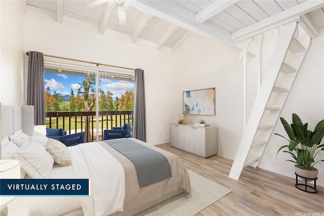 95-046 Hokuiwa St Unit 12, Mililani, HI 96789 - bedroom featuring access to exterior, beam ceiling, light wood-type flooring, and high vaulted ceiling
