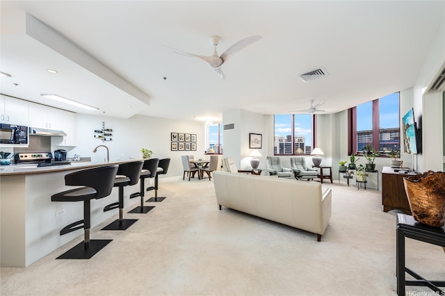 725 Kapiolani Blvd Unit 3503, Honolulu, HI 96813 - living room with ceiling fan, light carpet, and visible vents