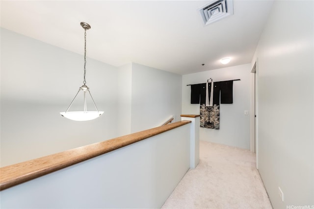 725 Kapiolani Blvd Unit 3503, Honolulu, HI 96813 - hallway featuring light colored carpet, an upstairs landing, and visible vents
