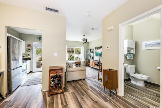 91-1059 Keoneula Blvd Unit F3, Ewa Beach, HI 96706 - hallway featuring wood finish floors, visible vents, and baseboards