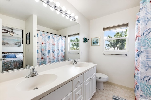 91-1059 Keoneula Blvd Unit F3, Ewa Beach, HI 96706 - bathroom featuring double vanity, connected bathroom, toilet, and a sink