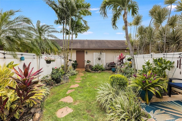 91-1059 Keoneula Blvd Unit F3, Ewa Beach, HI 96706 - view of front facade with fence, roof with shingles, and a front yard
