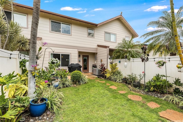 91-1059 Keoneula Blvd Unit F3, Ewa Beach, HI 96706 - rear view of house with a fenced backyard and a lawn