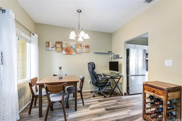 91-1059 Keoneula Blvd Unit F3, Ewa Beach, HI 96706 - dining space featuring baseboards, a chandelier, and light wood-style floors