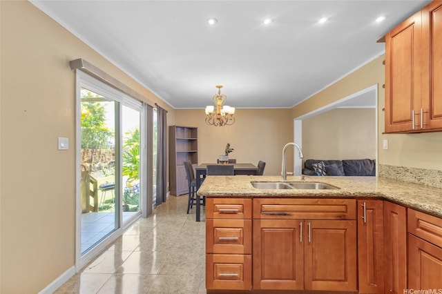 98-525 Kamahao Pl Unit 27, Pearl City, HI 96782 - kitchen featuring an inviting chandelier, a sink, a peninsula, brown cabinetry, and light stone counters