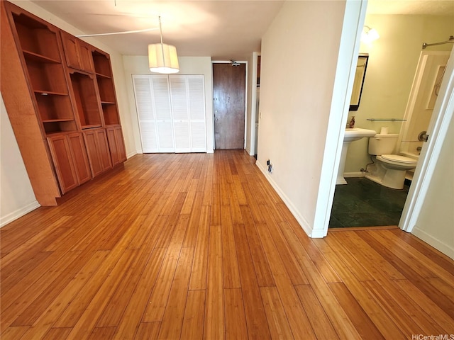 965 Prospect St Unit 307, Honolulu, HI 96822 - unfurnished dining area with light wood finished floors and baseboards