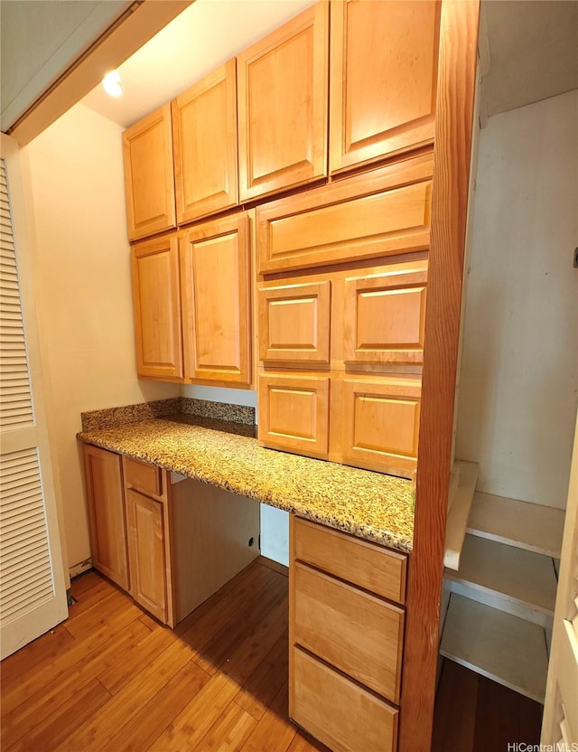 965 Prospect St Unit 307, Honolulu, HI 96822 - kitchen with light wood-style floors and light stone counters