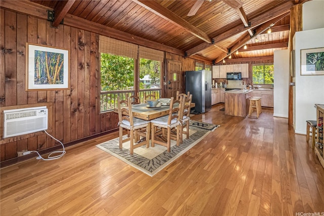 84-215 Makau St, Waianae, HI 96792 - dining room featuring wood ceiling, light wood-style flooring, a wall mounted air conditioner, healthy amount of natural light, and wood walls