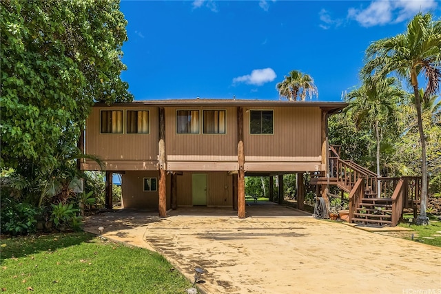 84-215 Makau St, Waianae, HI 96792 - view of front of home with concrete driveway, stairs, and a carport