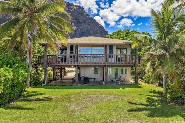 84-215 Makau St, Waianae, HI 96792 - rear view of house with a patio area, a deck with mountain view, and a yard