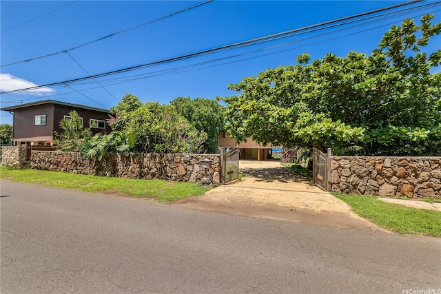 84-215 Makau St, Waianae, HI 96792 - view of front of house featuring concrete driveway and fence
