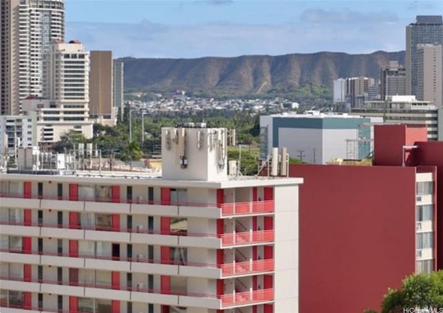 property's view of city featuring a mountain view
