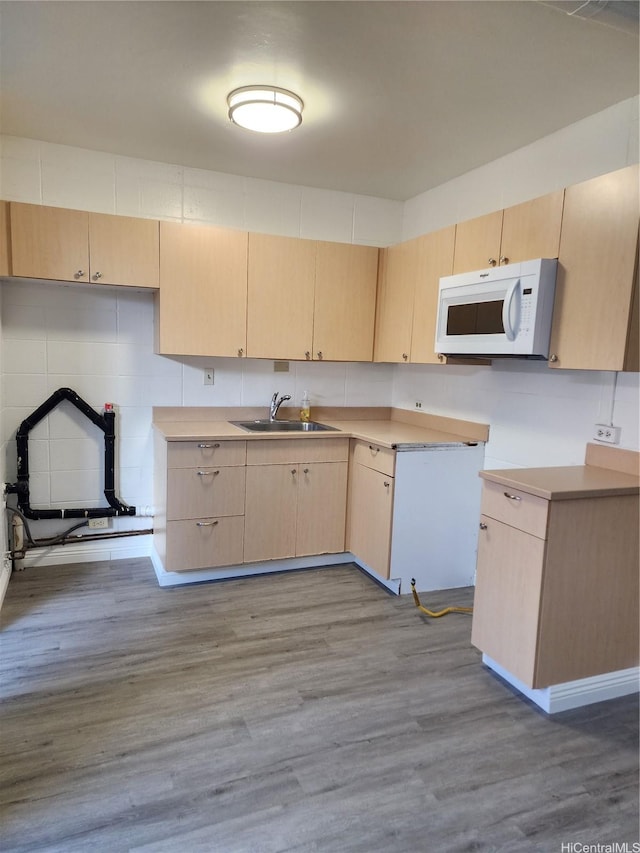 2050 Nuuanu Ave Unit 109, Honolulu, HI 96817 - kitchen featuring white microwave, light brown cabinetry, light countertops, and wood finished floors