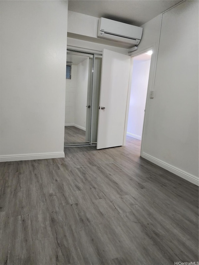 2050 Nuuanu Ave Unit 109, Honolulu, HI 96817 - finished below grade area with a wall mounted air conditioner and wood finished floors