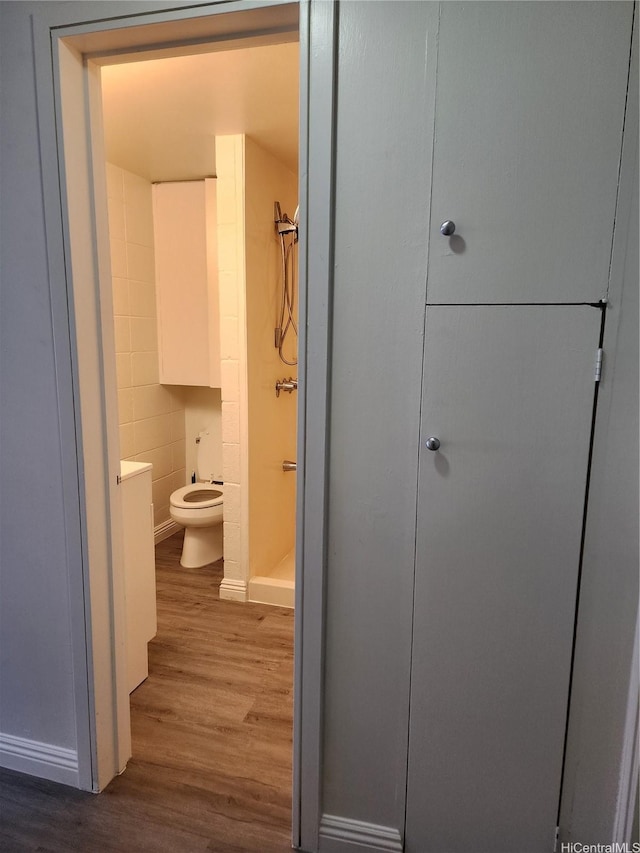 2050 Nuuanu Ave Unit 109, Honolulu, HI 96817 - bathroom featuring wood finished floors, a shower stall, and vanity