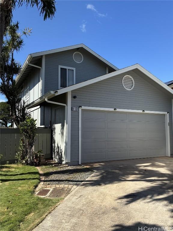 view of front facade with an attached garage and driveway