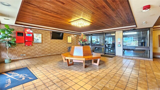 2415 Ala Wai Blvd Unit 1401, Honolulu, HI 96815 - common area with wooden ceiling and wallpapered walls
