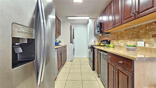 2415 Ala Wai Blvd Unit 1401, Honolulu, HI 96815 - kitchen with appliances with stainless steel finishes, light tile patterned floors, tasteful backsplash, and light countertops