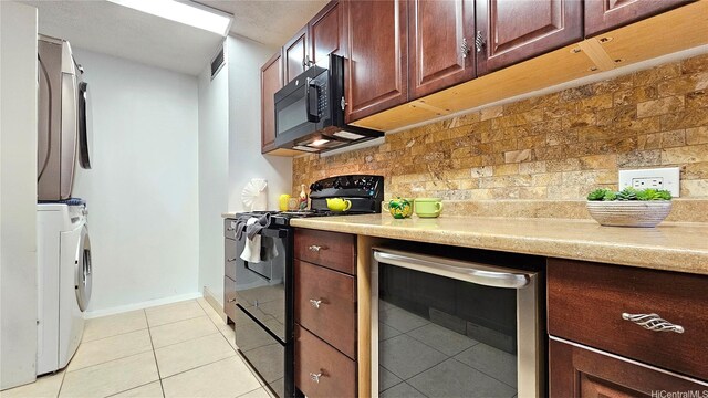 2415 Ala Wai Blvd Unit 1401, Honolulu, HI 96815 - kitchen with black appliances, beverage cooler, light tile patterned floors, decorative backsplash, and light countertops